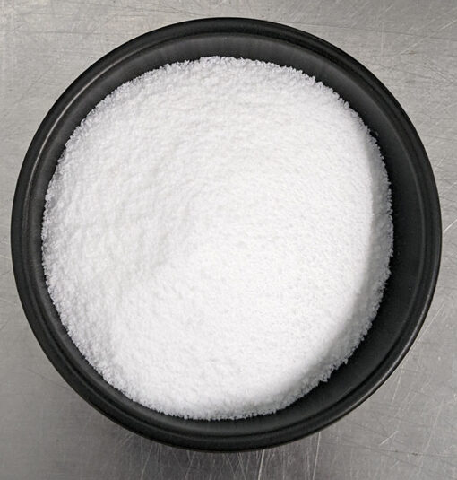 White, fine waxy solid pebbles of Stearic Acid.